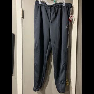 Reebok joggers/ track pants, grey with reflective strip on side, XL.